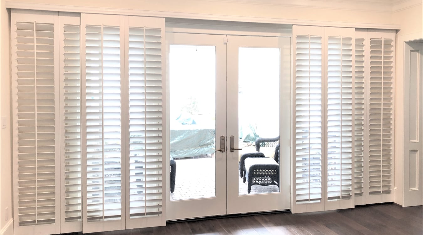 Plantation shutters on a sliding door